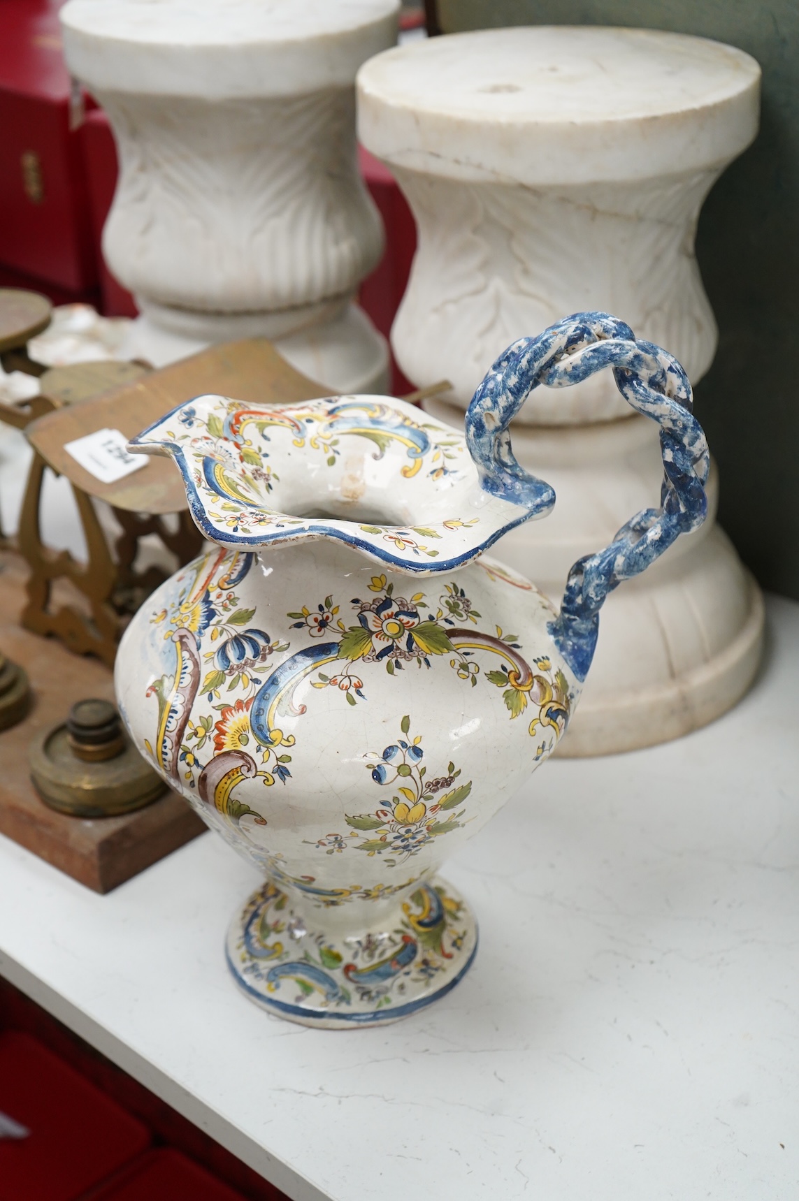 Two large French faience jugs and a vase, and a Talavera twin handled urn/vase, 44cm high